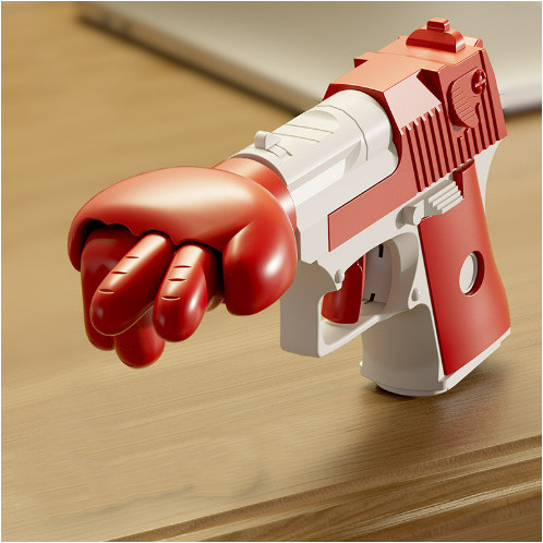 Spring-Loaded Punch Gun Gag Toy — photo 3