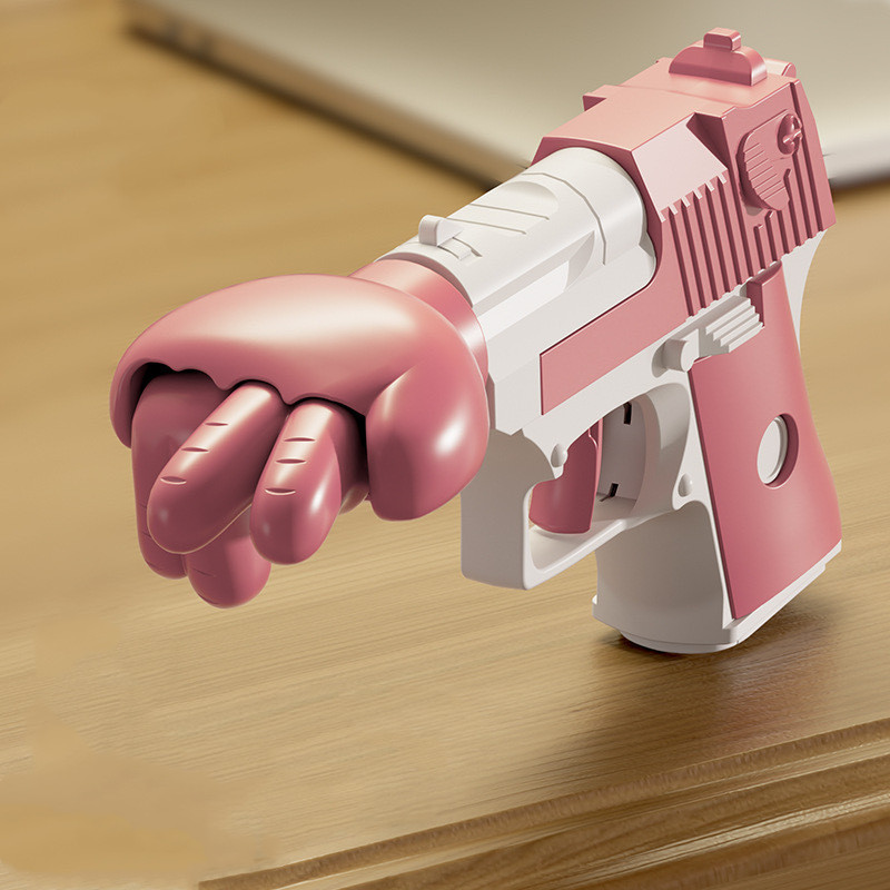 Spring-Loaded Punch Gun Gag Toy — photo 5
